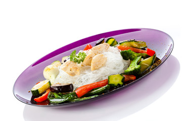 Roasted meat, rice noodles and vegetables on white background