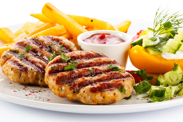 Grilled steak, French fries and vegetables