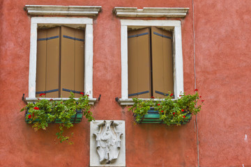Fototapeta na wymiar Typical Venetian Colored windows. Venice, Italy,