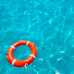 Buoy orange floating in perfect tropical beach