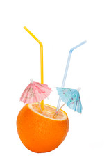 Orange is made an incision with umbrellas and straws