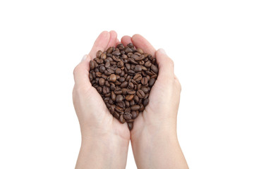 Coffee beans in human hand isolated on white