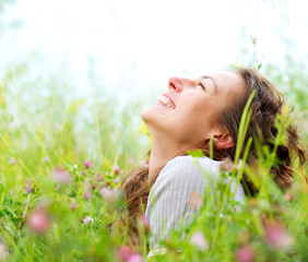 Beautiful Young Woman Outdoors. Enjoy Nature. Meadow