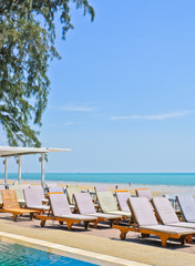 Lounge chairs at tropical beach