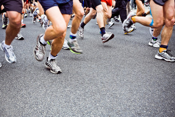 People running marathon on city street