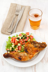 grilled chicken with vegetable salad on the plate