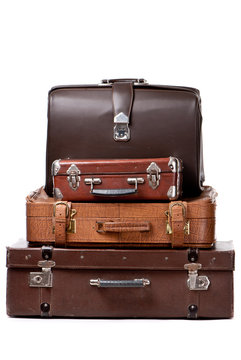 Old suitcases isolated on a white background