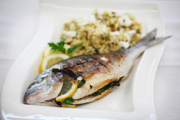 Sea bream grilled with lemons and parsley with couscous