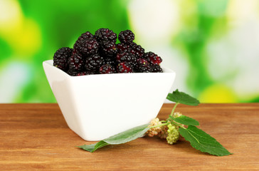 White bowl with ripe mulberries