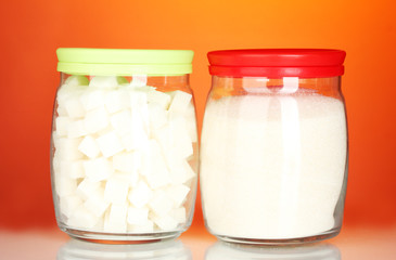 Jars with white lump sugar and white crystal sugar