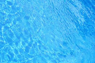 Hotel swimming pool with sunny reflections