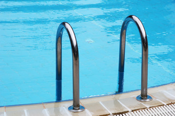 Hotel swimming pool with sunny reflections