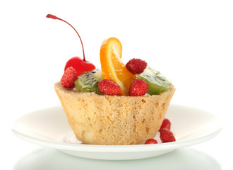 sweet cake with fruits on plate isolated on white