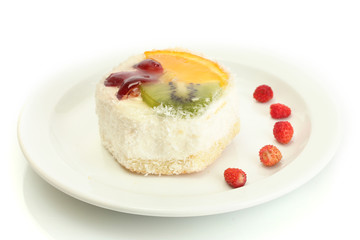 sweet cake with fruits on plate isolated on white