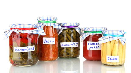 Jars with canned vegetables isolated on white