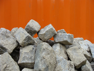 stack of cobble stone with orange backdrop