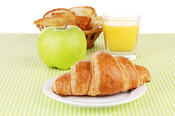 Classical breakfast. Orange juice and croissant