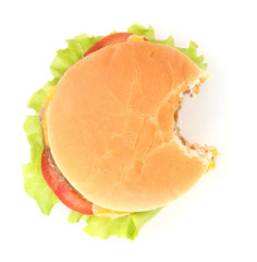 Bitten cheeseburger isolated on white