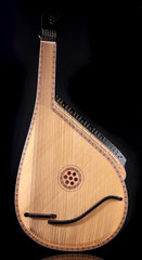 Retro bandura- Ukrainian musical instrument on black background