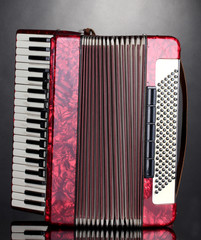 Retro accordion on grey background