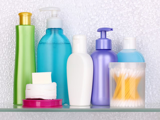 Shelf with cosmetics and toiletries in bathroom