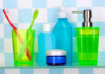 Shelf with cosmetics and toiletries in bathroom