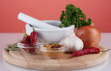 Composition of White mortar and pestle with spice and