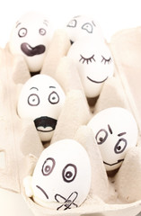 Obraz premium White eggs with funny faces