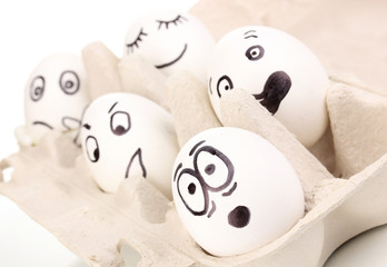 White eggs with funny faces