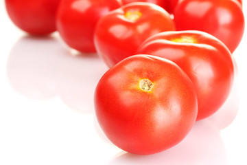 Ripe red tomatoes isolated on white