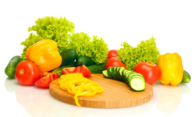 fresh vegetables on cutting board isolated on white