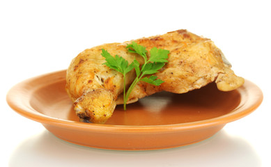 roasted chicken leg with parsley in the plate isolated on white