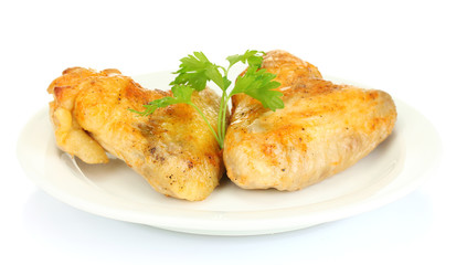 roasted chicken wings with parsley in the plate isolated