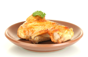 roasted chicken wings with parsley in the plate isolated