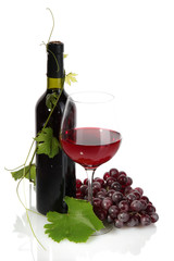 bottle, glass of wine and ripe grapes isolated on white