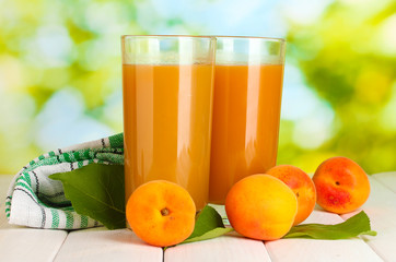 glasses of apricot juice  and fresh apricots