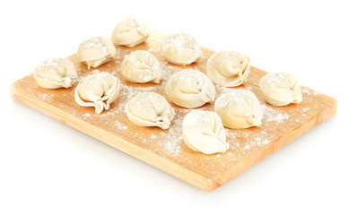 Raw Dumplings on cutting board isolated on white