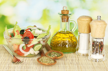 tasty greek salad on bright green background