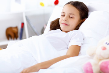 Obraz na płótnie Canvas Girl sleeping in bed at home