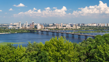 Fototapeta na wymiar View of Paton Bridge and Left Bank of the Dnieper river in Kyiv