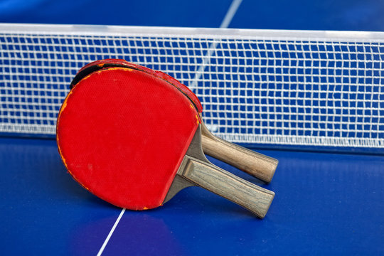 Two table tennis or ping pong rackets and balls 