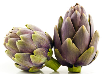 Fototapeta premium Two Artichoke Fruits Isolated