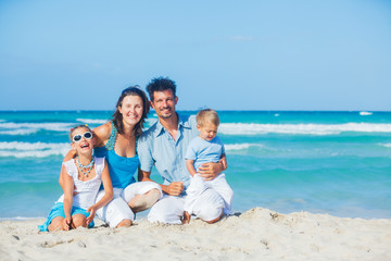 Family having fun on tropical beach