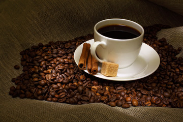Coffee beans and white cup