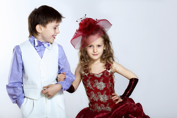 Little girl in beautiful dress and boy