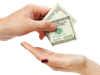 Hand of man giving hundred dollars to womans hand