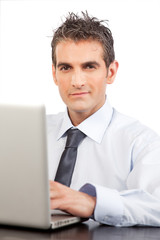 Businessman Using Laptop At Work