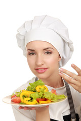 Pretty cook chief holding salad