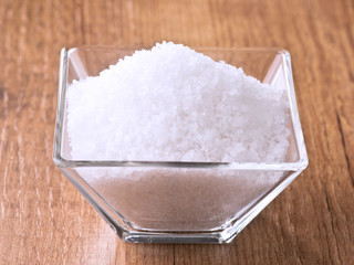 salt flakes in small glass bowl