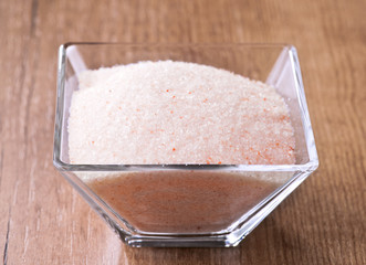 Himalayan pink salt in small bowl of glass.